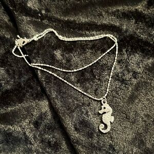 Ankle bracelet. Silver toned. Double strand with rhinestones studded seahorse.
